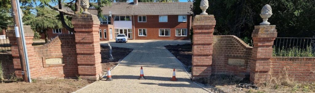 This is a photo of a newly installed chip and tar driveway, installed by Chatteris Driveways